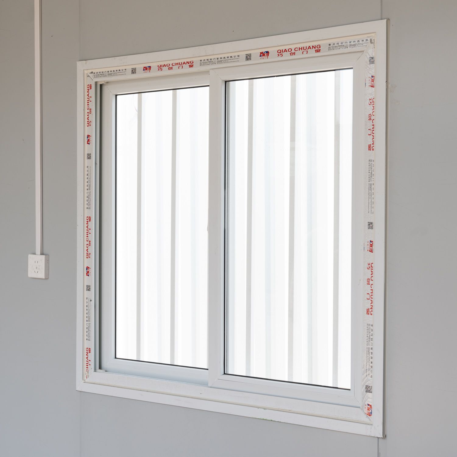 Supplier sample interior window in a plain enclosed modular space